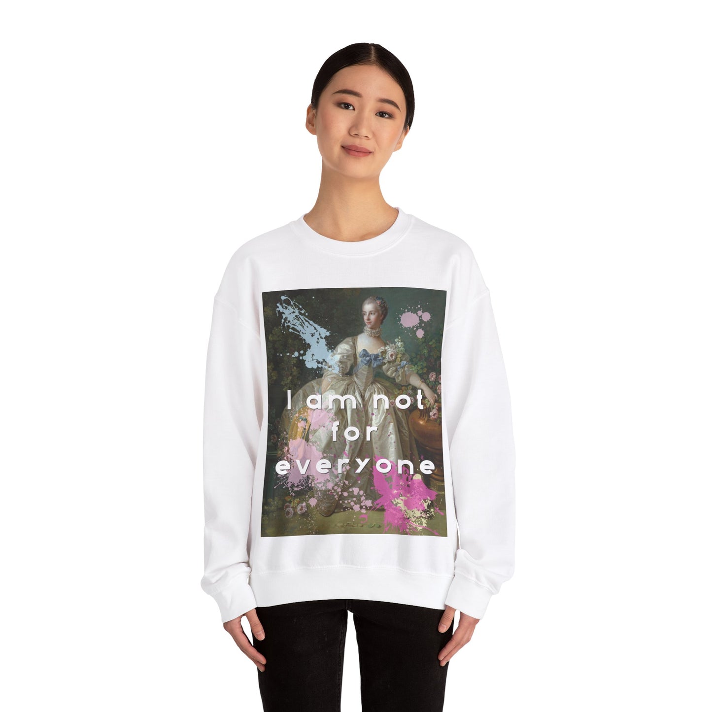 Lifestyle image of the cozy heavy-blend cotton and polyester Crewneck sweatshirt in white featuring and altered piece of classical art on the front. The altered piece is the original Madame Bergeret from 1766, a high society girl in a off-white voluminous dress surrounded by flowers. We have modernized the piece by adding bold and bright paint splashes in yellow, light blue, and hot pink and the phrase,” I am not for everyone”