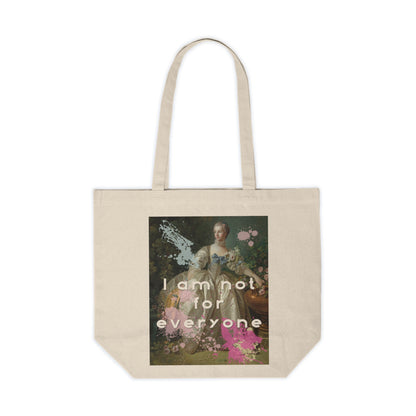 An 18”x15"cotton canvas shopping tote featuring an altered piece of classical art on one side. The altered piece is the original Madame Bergeret from 1766 - a high society girl in a off white voluminous dress surrounded by flowers. We have modernized the piece by adding bold and bright paint splashes and the phrase,” I am not for everyone"