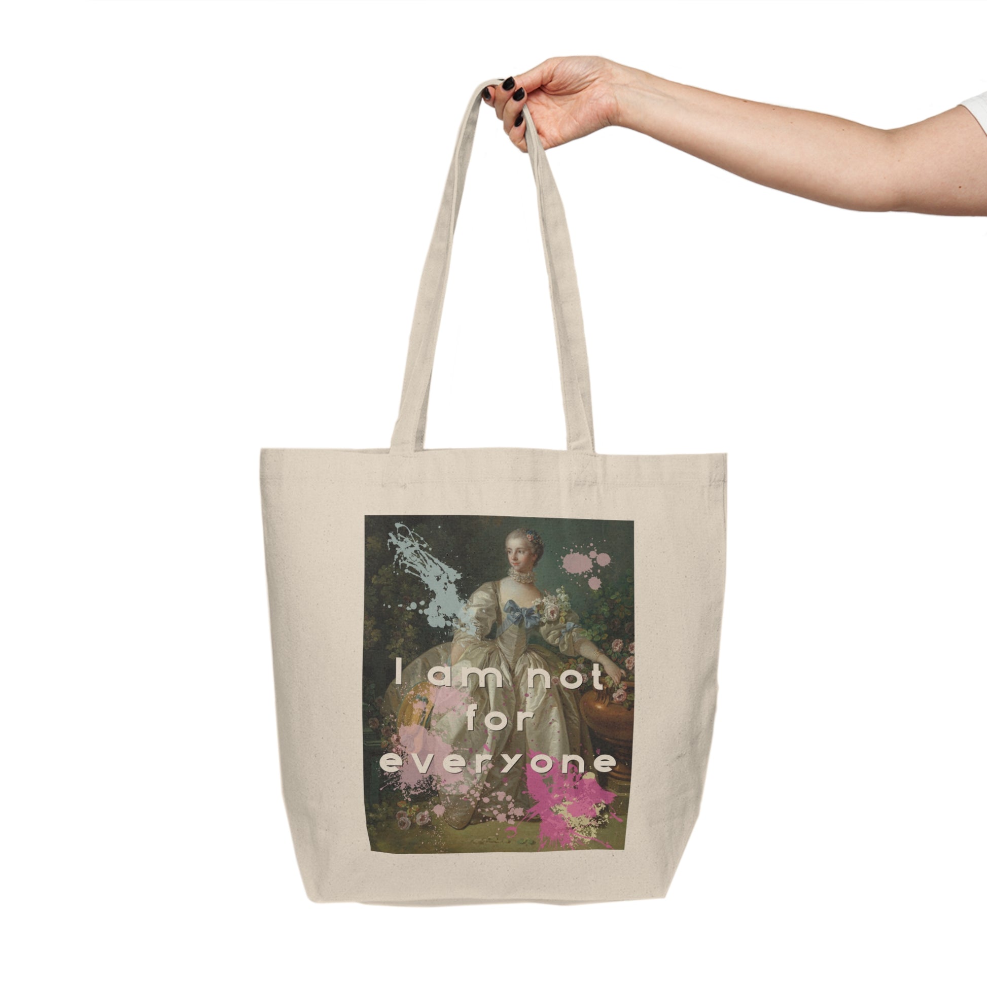 An 18”x15"cotton canvas shopping tote featuring an altered piece of classical art on one side. The altered piece is the original Madame Bergeret from 1766 - a high society girl in a off white voluminous dress surrounded by flowers. We have modernized the piece by adding bold and bright paint splashes and the phrase,” I am not for everyone"